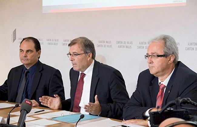 André Mudry, Jean-Michel Cina und Philipp Spörri an der Pressekonferenz in Sitten.