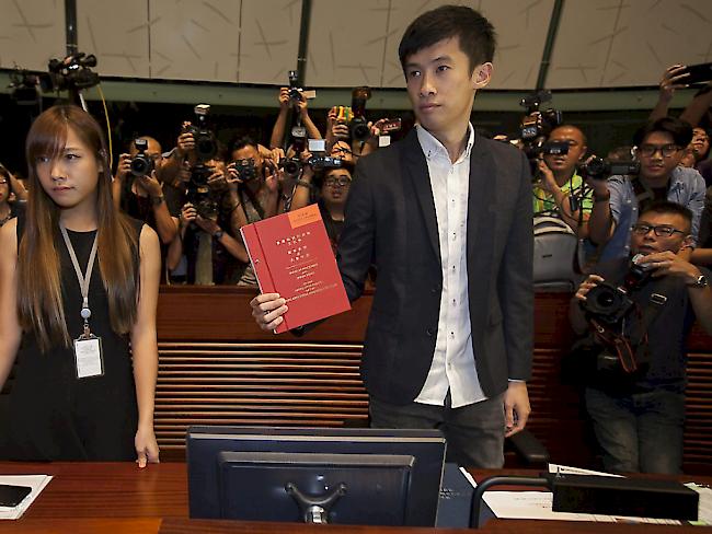 Diese beiden Unabhängigkeitsbefürworter in Hongkong beschäftigen Politik und Gerichte. (Archivbild)